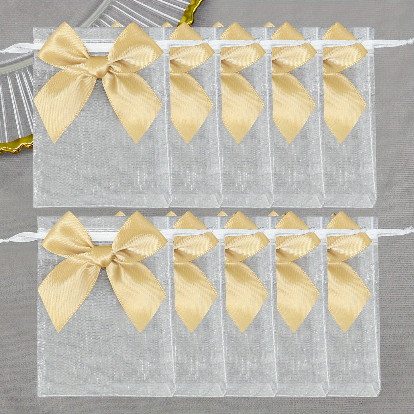 10 elegant organza bags with ribbon and bow, ideal for gift wrapping and party favors.