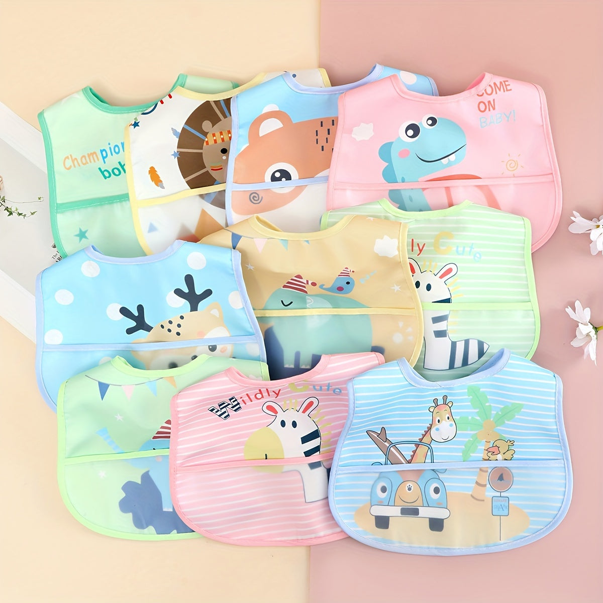 Three waterproof bibs for boys, in assorted colors. Made of polyester fiber, these anti-dirty nursery aprons are perfect for babies and toddlers.