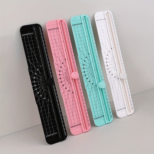 Compact manual paper cutter with grid pattern for precise cutting, ideal for scrapbooking and crafting in assorted colors. Made of durable plastic.