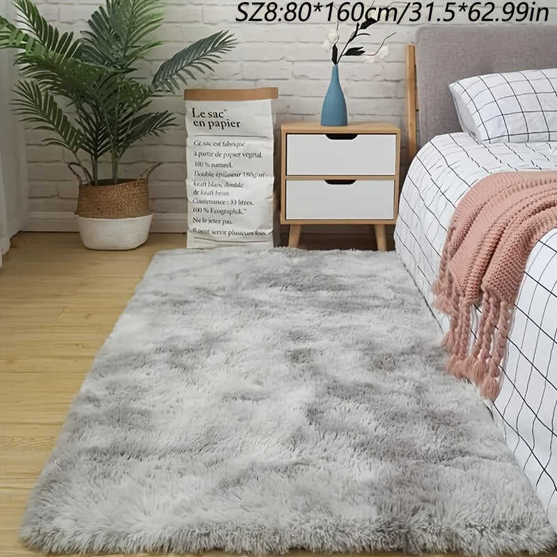 A stylish light grey tie-dye gradient plush carpet perfect for your living room, coffee table, or bedside. This long-haired washable mat is ideal for adding a touch of Nordic style to your bedroom.