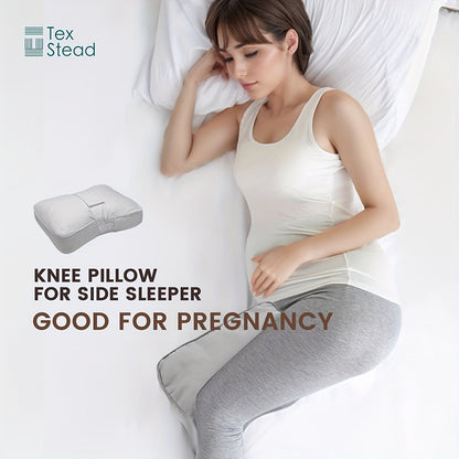 TEXSTEAD Knee Pillow is specially designed for side sleepers to provide ergonomic support for the legs, promoting spine alignment and offering relief for pregnant women. The pillow comes with a machine washable cover made of woven polyester, and is