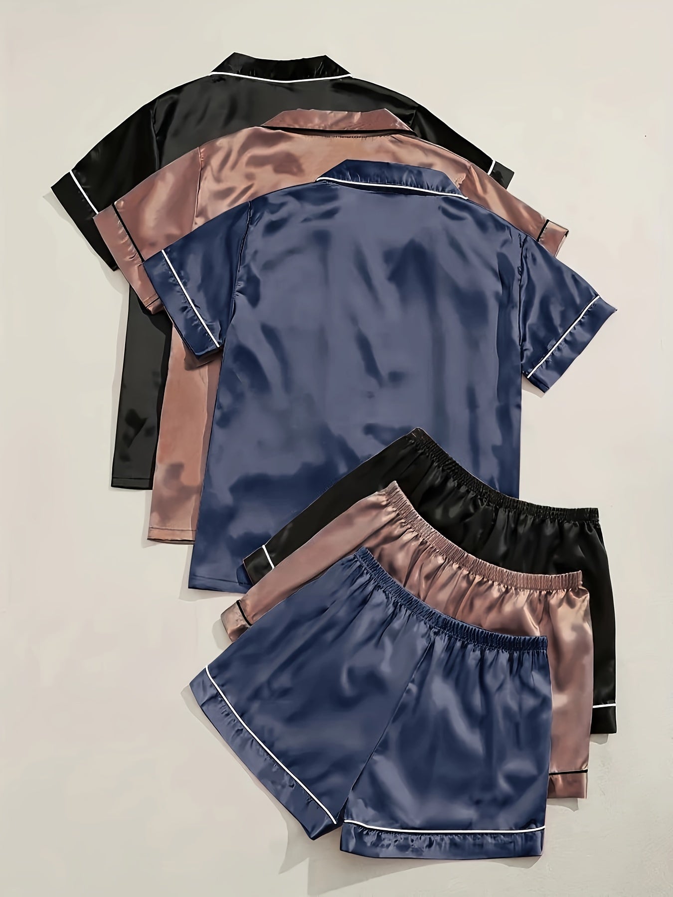 Solid satin pajamas with short sleeve button top and elastic shorts for women's sleepwear.