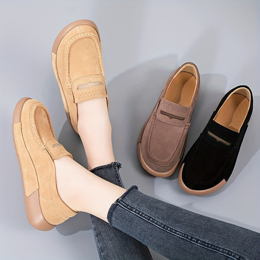 Women's slip-on loafers in solid color with round toe, casual low-top design.