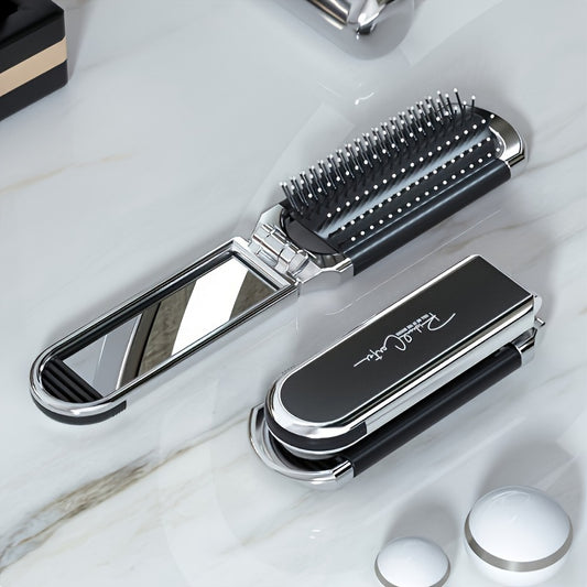 Travel-size folding hair brush with anti-static properties, drawable mirror, durable ABS plastic handle, suitable for all hair types.