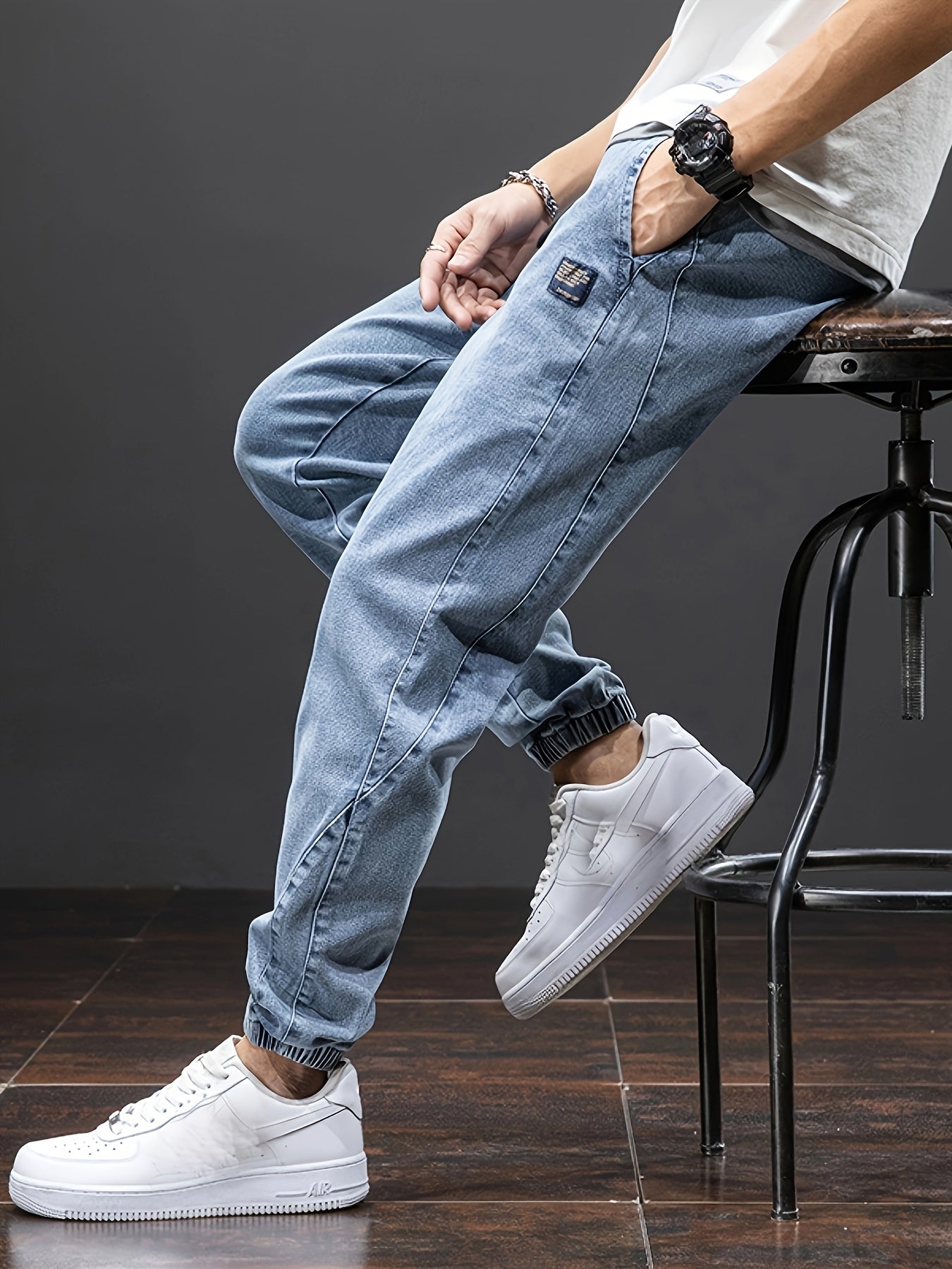 Men's mid-rise cropped jeans with elastic waistband made of 70.7% blend, solid color washed denim, regular fit for all-season wear.