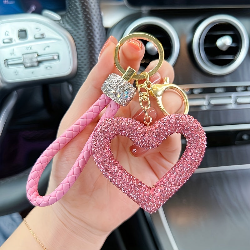 Heart-shaped resin keychain adorned with sparkling rhinestones, featuring a fun cartoon design for a touch of whimsy. Complete with a lobster clasp for easy attachment, this unique keyring is perfect for adding a festive touch to your holiday decor.