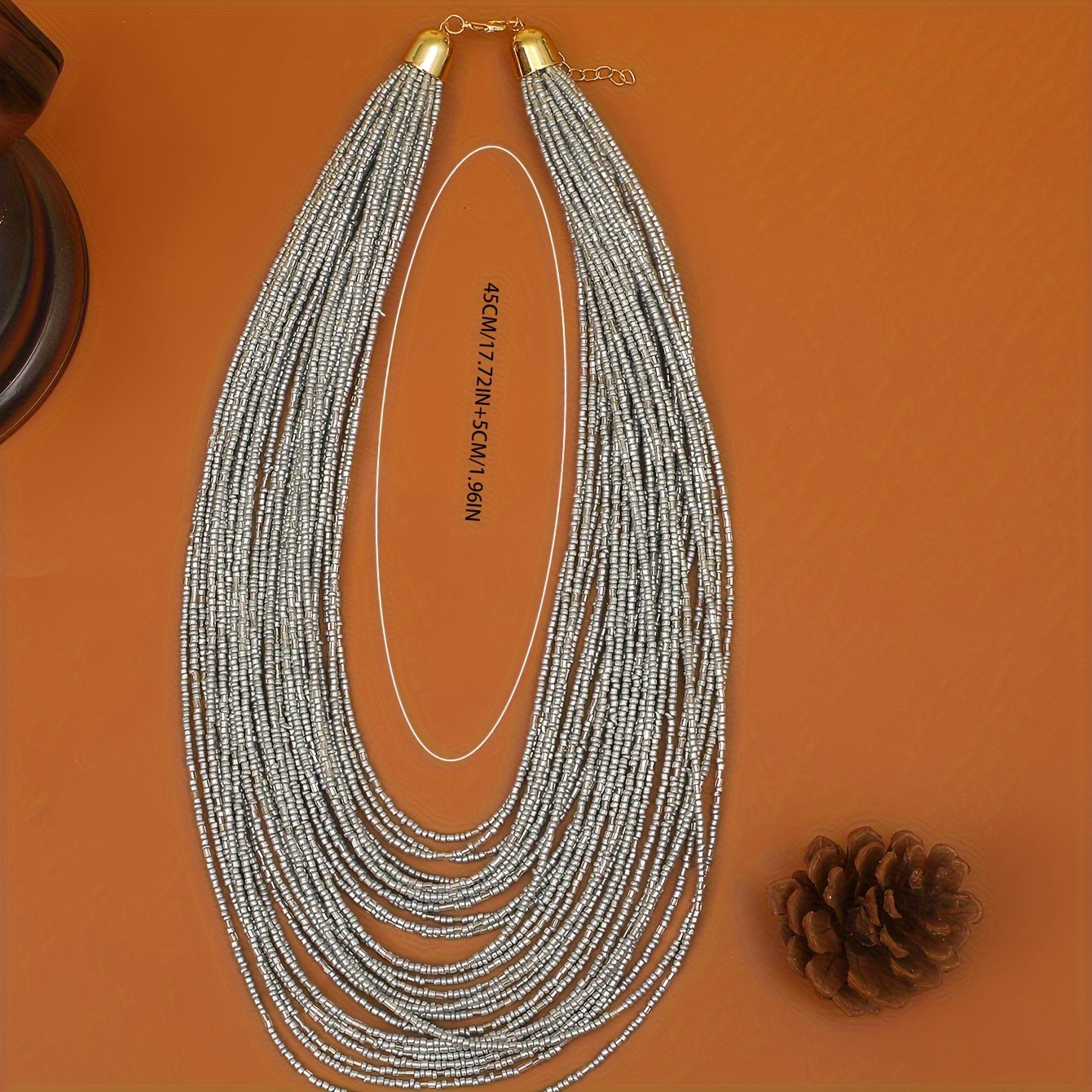 A trendy and flexible millet bead necklace with multiple layers.