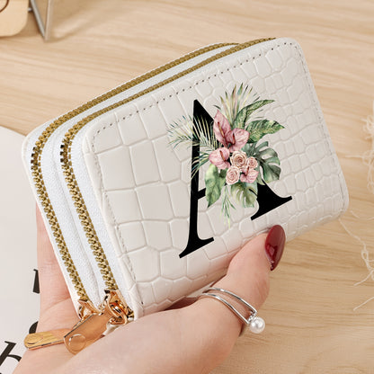 Women's credit card wallet with elegant floral letter print in black & white. Features large capacity, dual zipper, crocodile texture PU, lightweight design with nylon lining for everyday