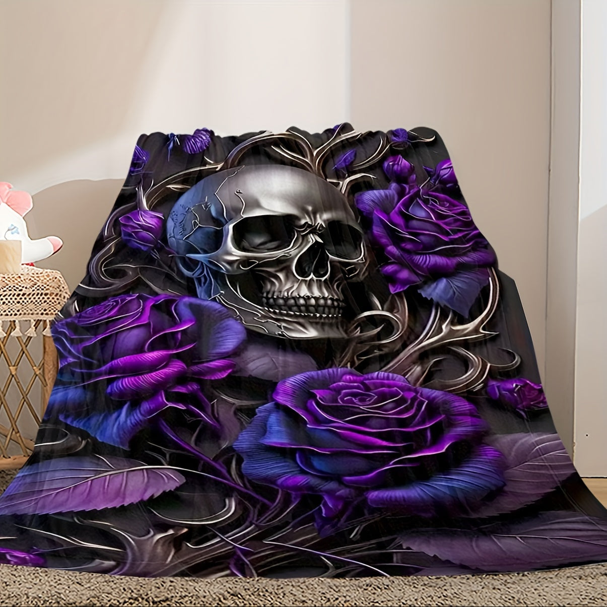 Soft, hypoallergenic flannel throw blanket featuring a traditional skull and roses print. This multipurpose blanket is perfect for all seasons and can be hand washed for easy maintenance. Made with soft polyester, it is ideal for boys, girls, and adults