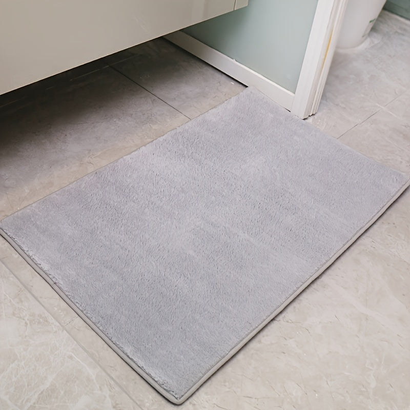 Machine-made oblong bath rug made from quick-dry absorbent knit fabric with non-slip features. Crafted from polyester fiber, this rug is 1.8cm thick and has a weight of 780gsm. Suitable for entryways, bedrooms, living rooms, and garages. Easy to care for