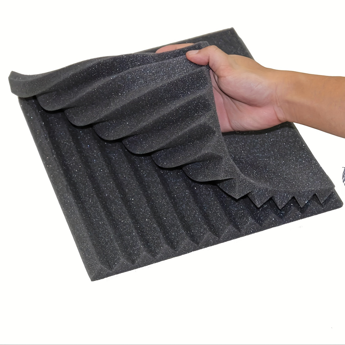 Box of 12 black acoustic foam panels measuring 2.54cm x 30.48cm x 30.48cm for sound absorption in studios and home offices. Fire-resistant and reduces reverb and echoes. Improves acoustic