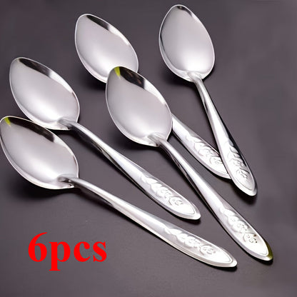 Set of 6 elegant dessert spoons made of stainless steel, featuring beautiful rose engravings. Ideal for use with coffee, fruit, and more. The shiny reflective finish makes them perfect for both home and restaurant use.