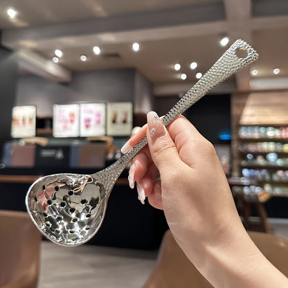 Sleek stainless steel long-handled spoon with leak-proof design, ideal for home and restaurant use.