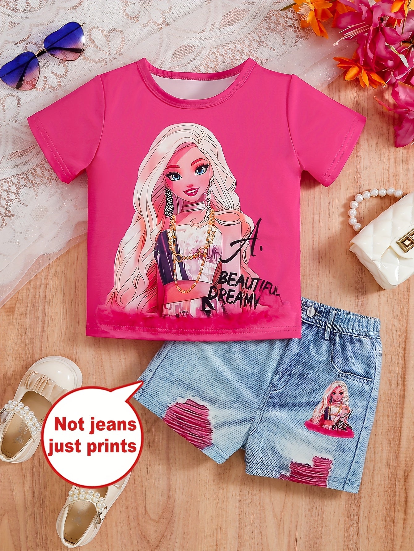 Cartoon print girls' short sleeve top and graphic shorts set, perfect for outdoor summer activities