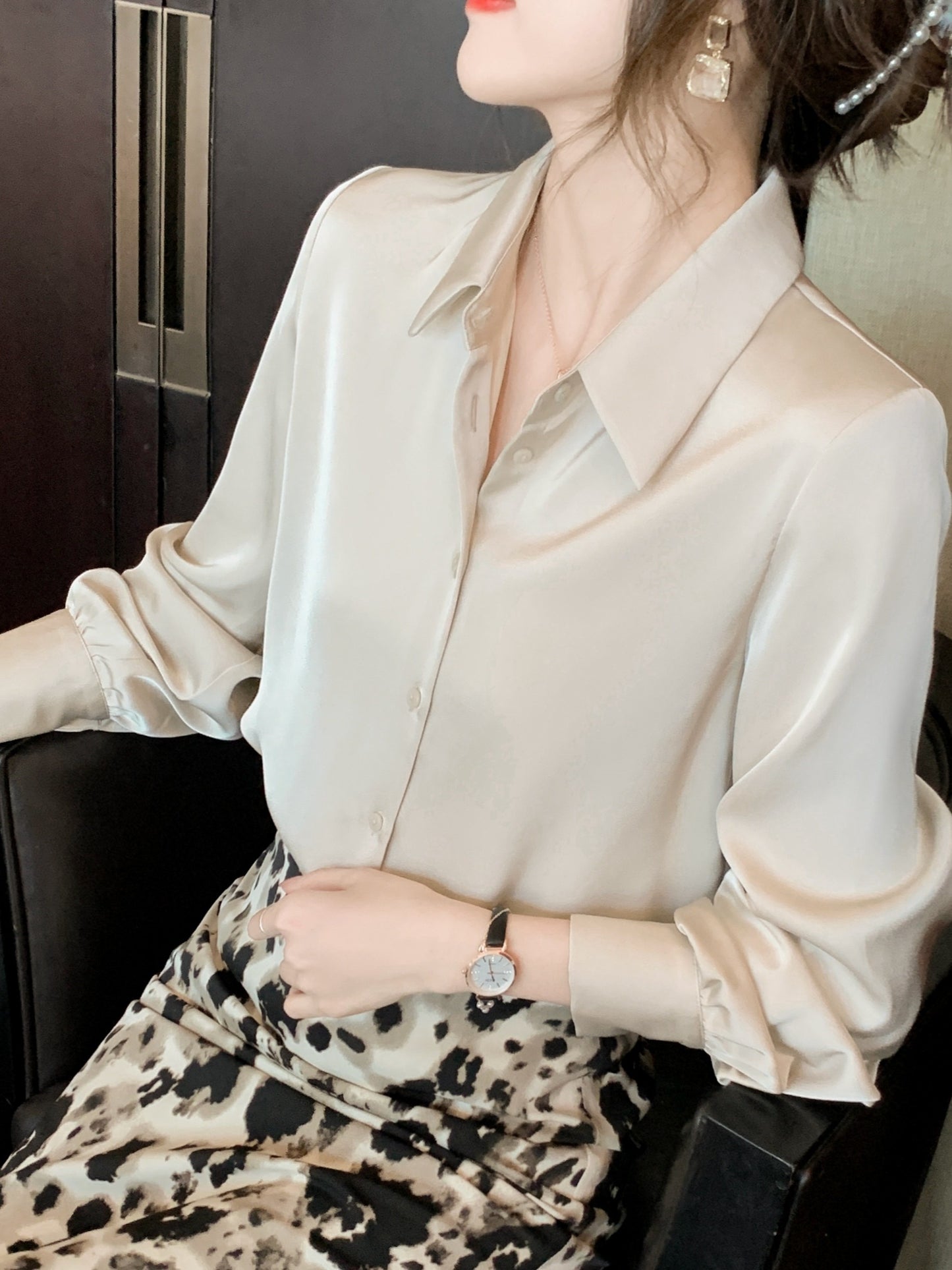 Women's chic solid color long sleeve blouse made of 100% polyester with lapel collar and button details. Suitable for all seasons.