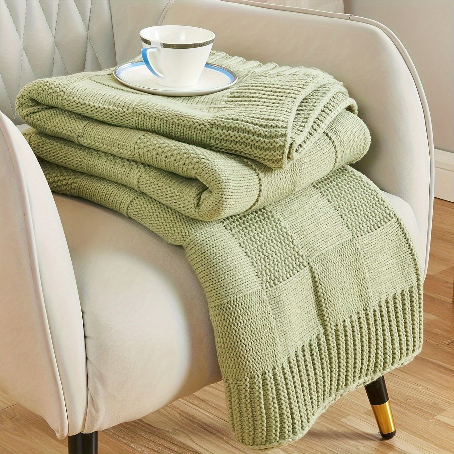 Soft and cozy knit throw blanket in white checkered pattern, perfect for couch or bed. Keep warm and stylish in any room with this knitted throw blanket.