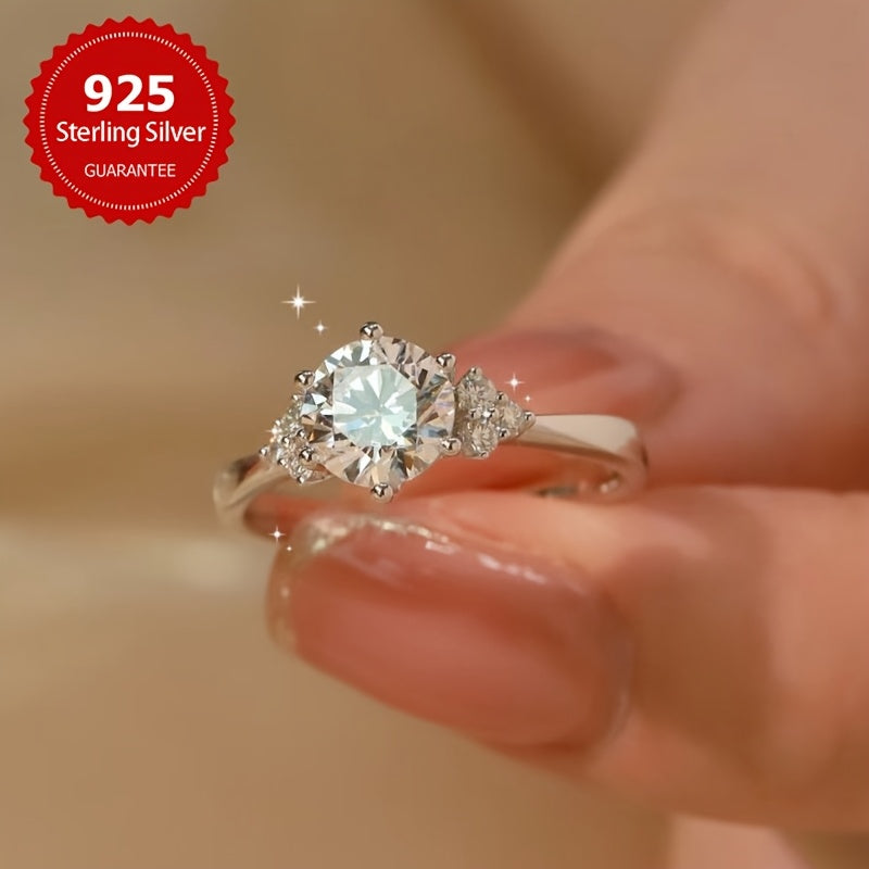 This elegant Moissanite engagement ring features a 1CT stone set in 925 sterling silver, with a silvery gram weight ranging from 5-9 yards. The shining Moissanite wings add a touch of luxury, making it the perfect gift for a loved one on Valentine's Day