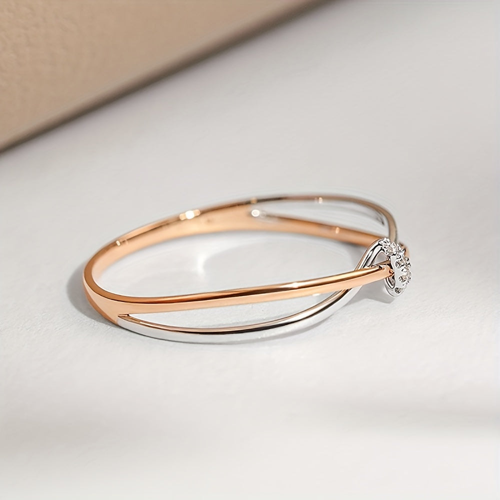 Rose Gold Double Knot Ring - This exquisite ring features elegant rose gold intertwined in a double knot design, crafted with 925 sterling silver and embellished with sparkling cubic zirconia stones. Perfect for celebrating your anniversary, this 2.0g