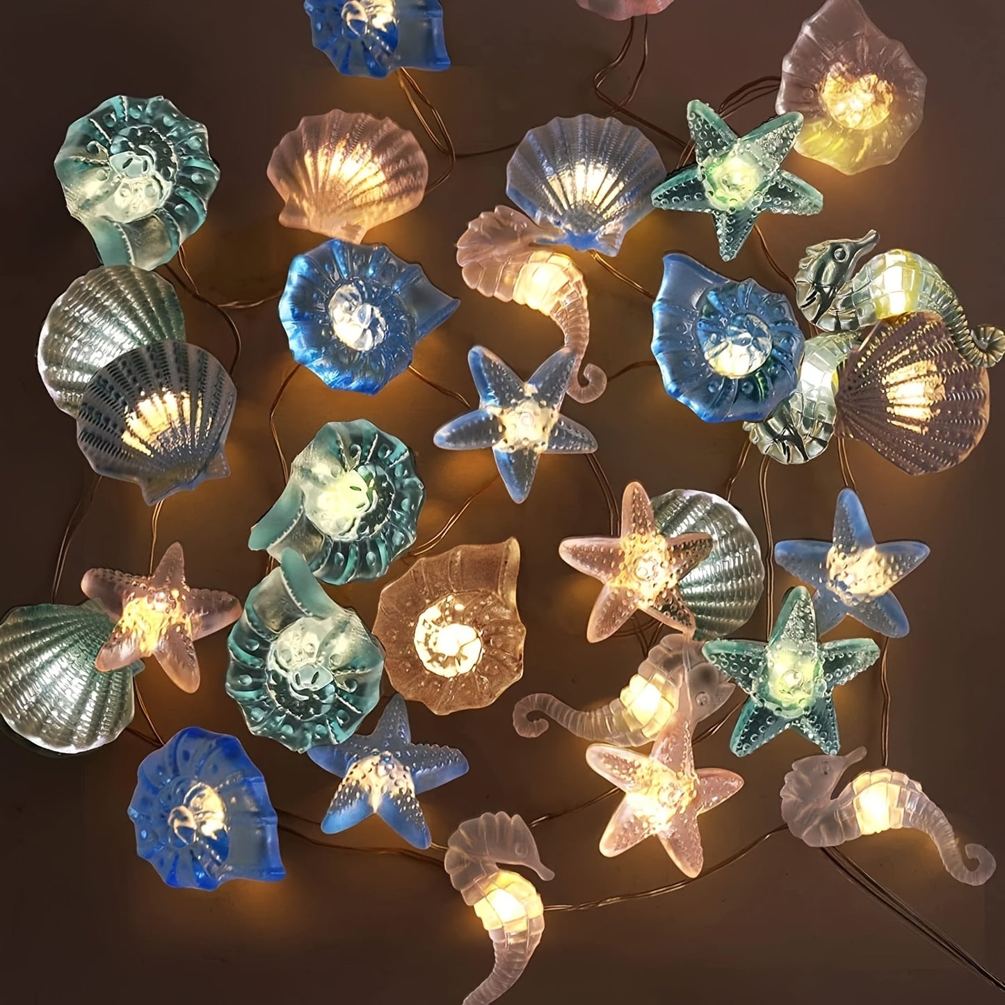 Sea Horse Starfish Shell Conch LED String Lights, Battery Operated for Decorative Lighting in various settings.