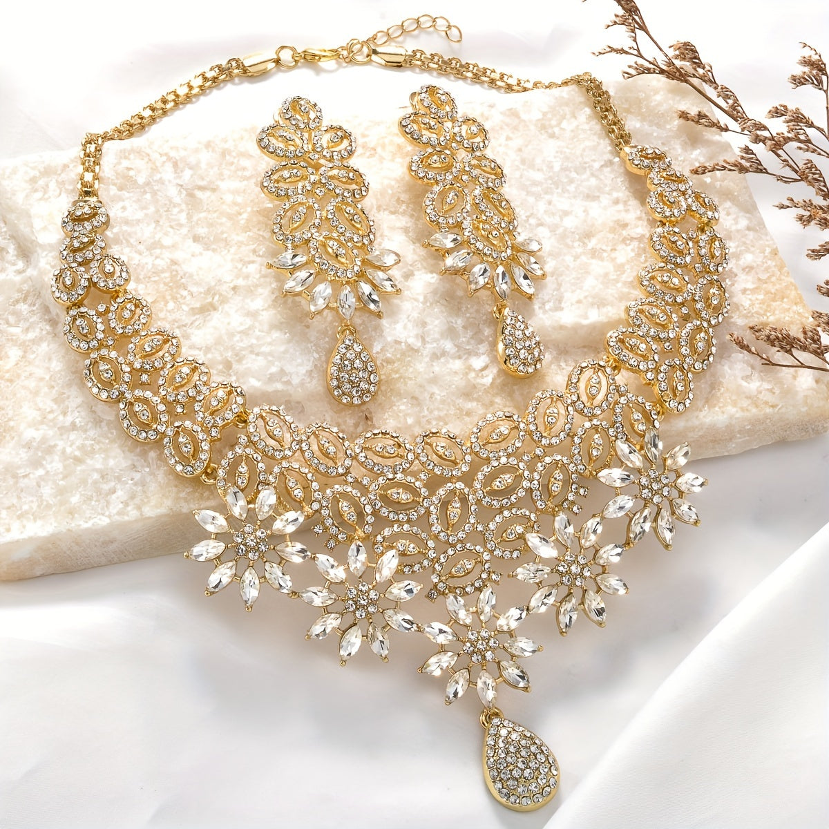 A stunning set of Middle Eastern Arabic bohemian style jewelry for women, including a pendant necklace, bracelet, earrings, and ring. This luxurious four-piece set features a retro flower pattern in elegant black, perfect for a bride. A shining and