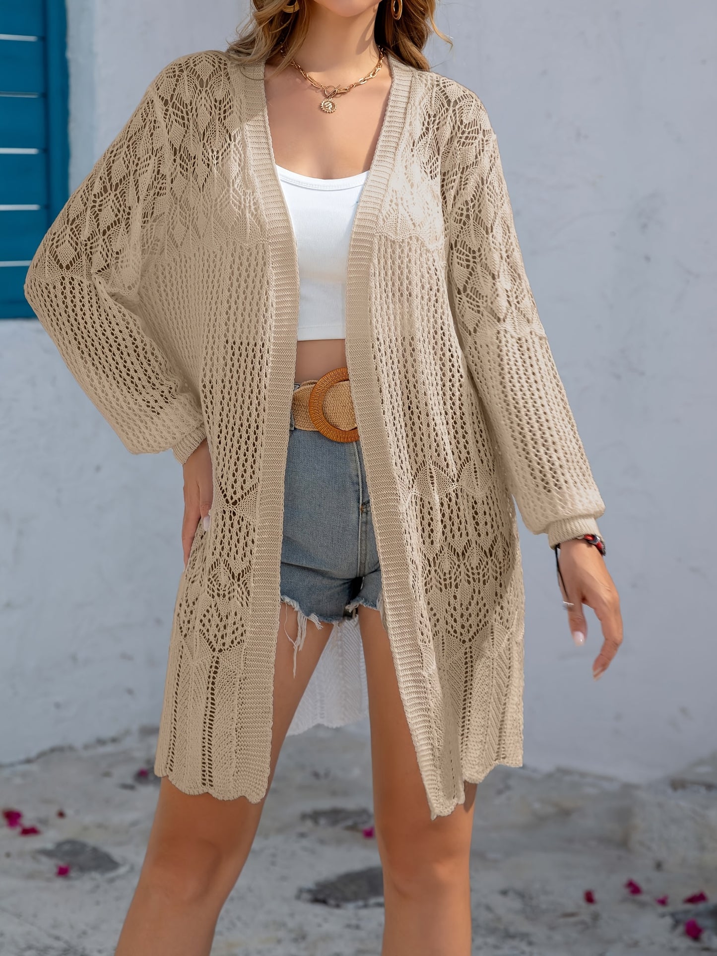 Women's elegant white lace cardigan in a floral pattern, perfect for spring/summer fashion with lightweight, long sleeve knit cover-up.