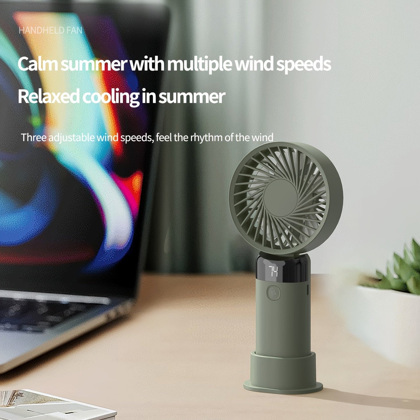 Portable handheld/desktop mini fan with adjustable angle, featuring 3 speeds, a digital display, long-lasting battery, dual-use standing and handheld design, USB charging, low-noise operation, and compact size ideal for office desk, bedside, or outdoor