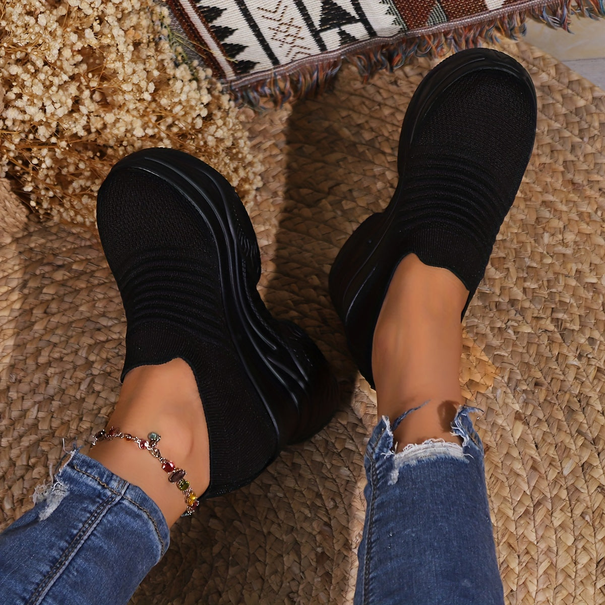 Women's slip-on sneakers with striped design, lightweight knit material, and thick platform sole for year-round wear.