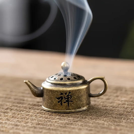 Elegant vintage teapot incense burner doubles as a metal aromatherapy diffuser for home or office use. Perfect for creating a calming atmosphere during yoga and meditation. Makes a thoughtful gift for adding fragrance to any space or holiday celebration.