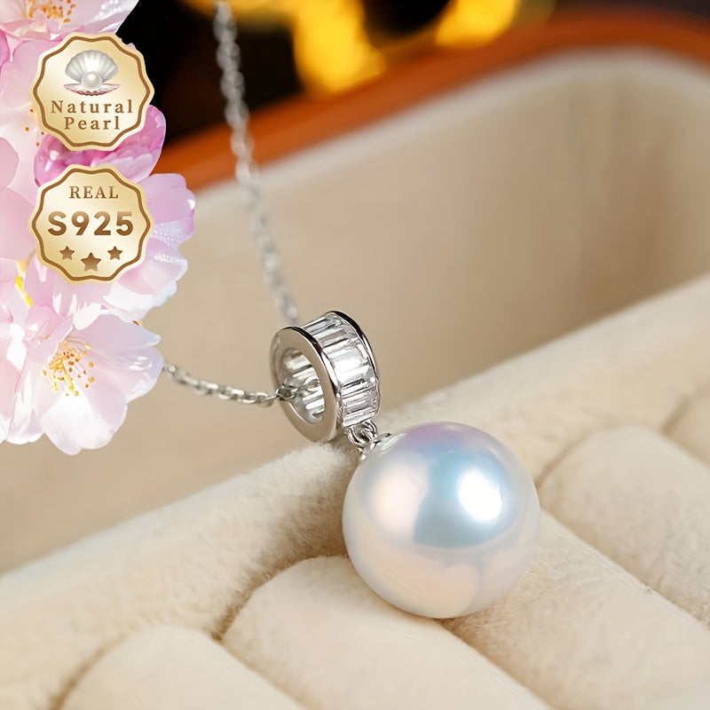 Surprise your loved one with this must-have gift - a stunning Pearl Necklace! This beautiful pendant necklace is made with S925 silver and features a 12-13mm round natural freshwater pearl. Each necklace is unique as natural pearls come in varying shapes