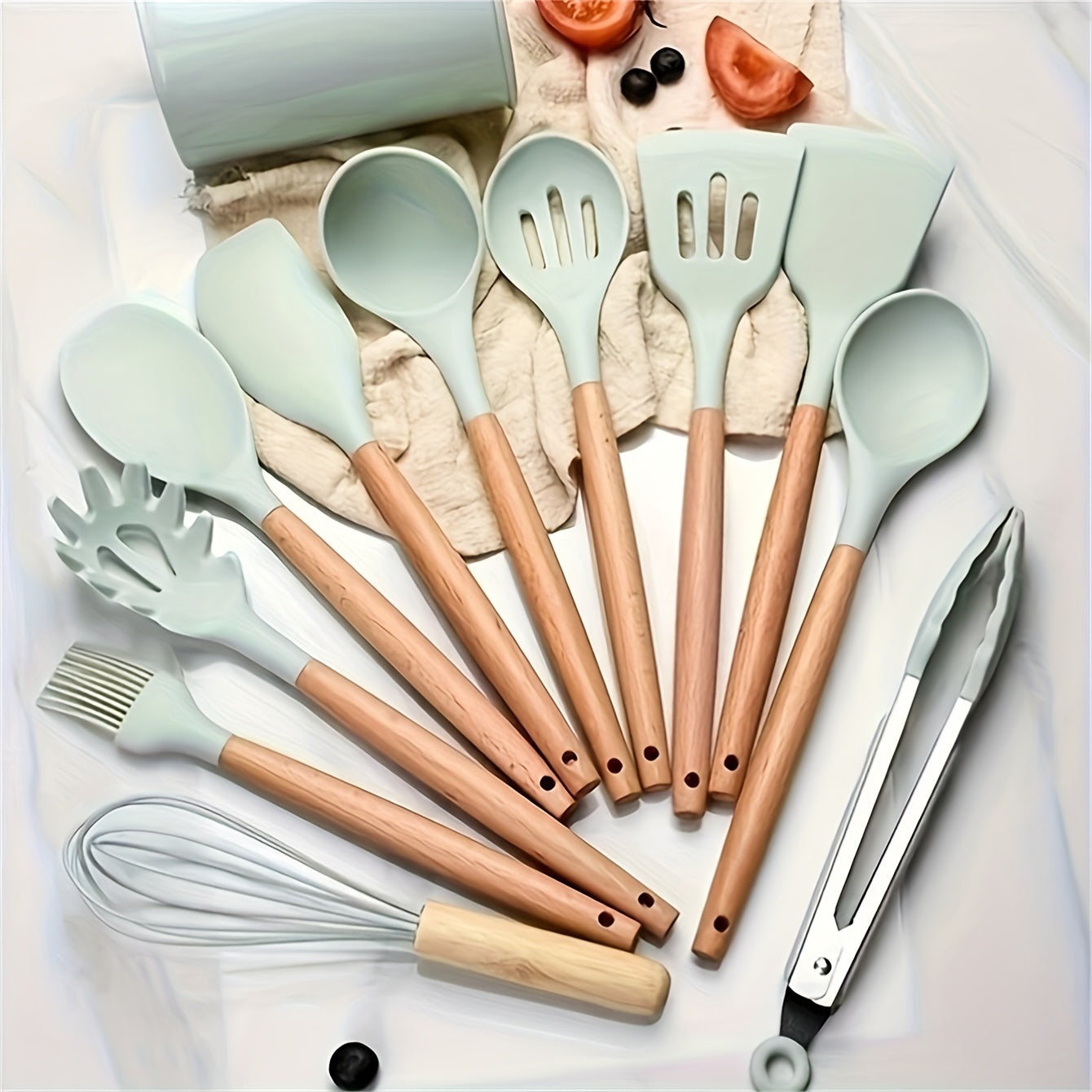 This set includes 12 pieces of silicone kitchenware with wooden handles, featuring a Japanese-inspired fresh light green and pink design. The modern, non-stick cookware set includes kitchen gadgets for a safe and hygienic cooking experience. Perfect for