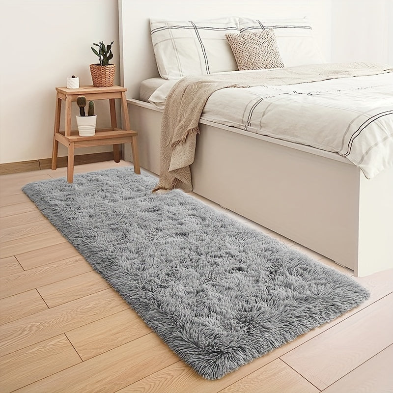 Soft and plush modern shaggy area rug, perfect for adding comfort and style to any indoor space. Made of polyester material, this decorative rug is ideal for living rooms, bedrooms, studies, and lounges. Dry clean only.