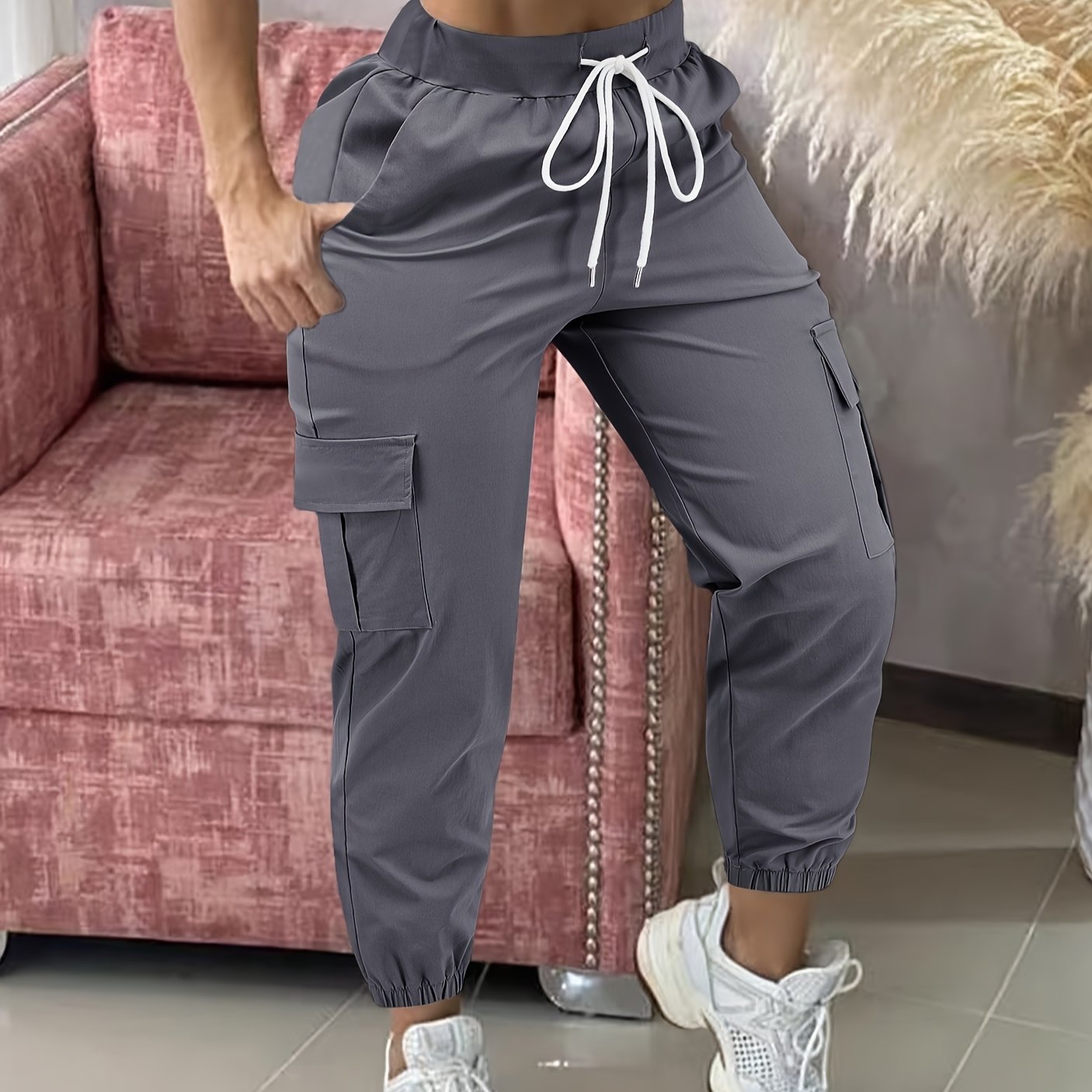 Women's casual cargo pants made of polyester with a drawstring waist.