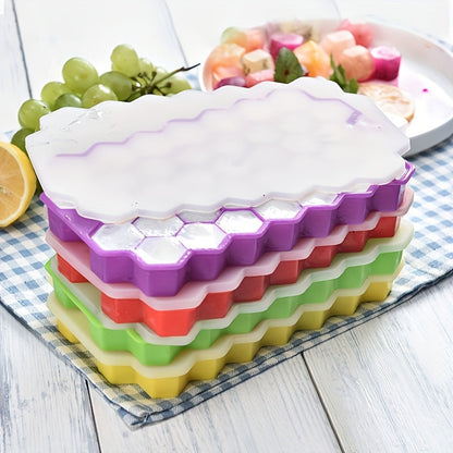 The Silicone Honeycomb Ice Tray is designed with 37 compartments and a lid for easy storage. Made of durable silicone, this tray is perfect for creating hexagonal ice cubes and can also be used for making chocolate, wax bottles, and candy. The flexible