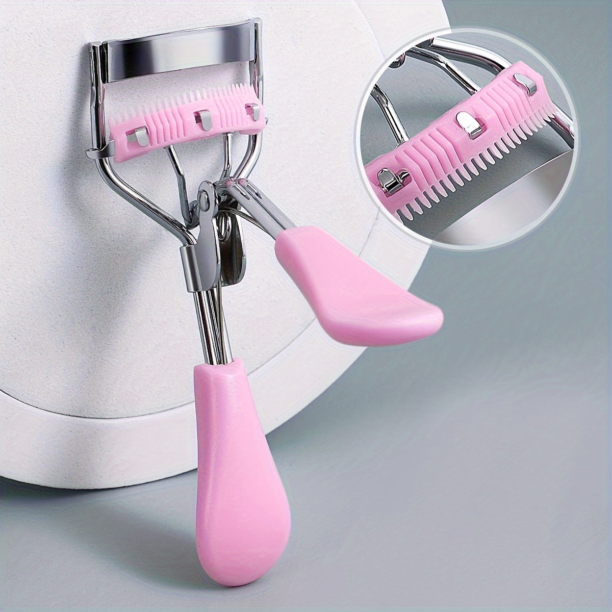 Compact eyelash curler with stainless steel curler and comb for lasting curl, ideal for daily use to enhance lashes.