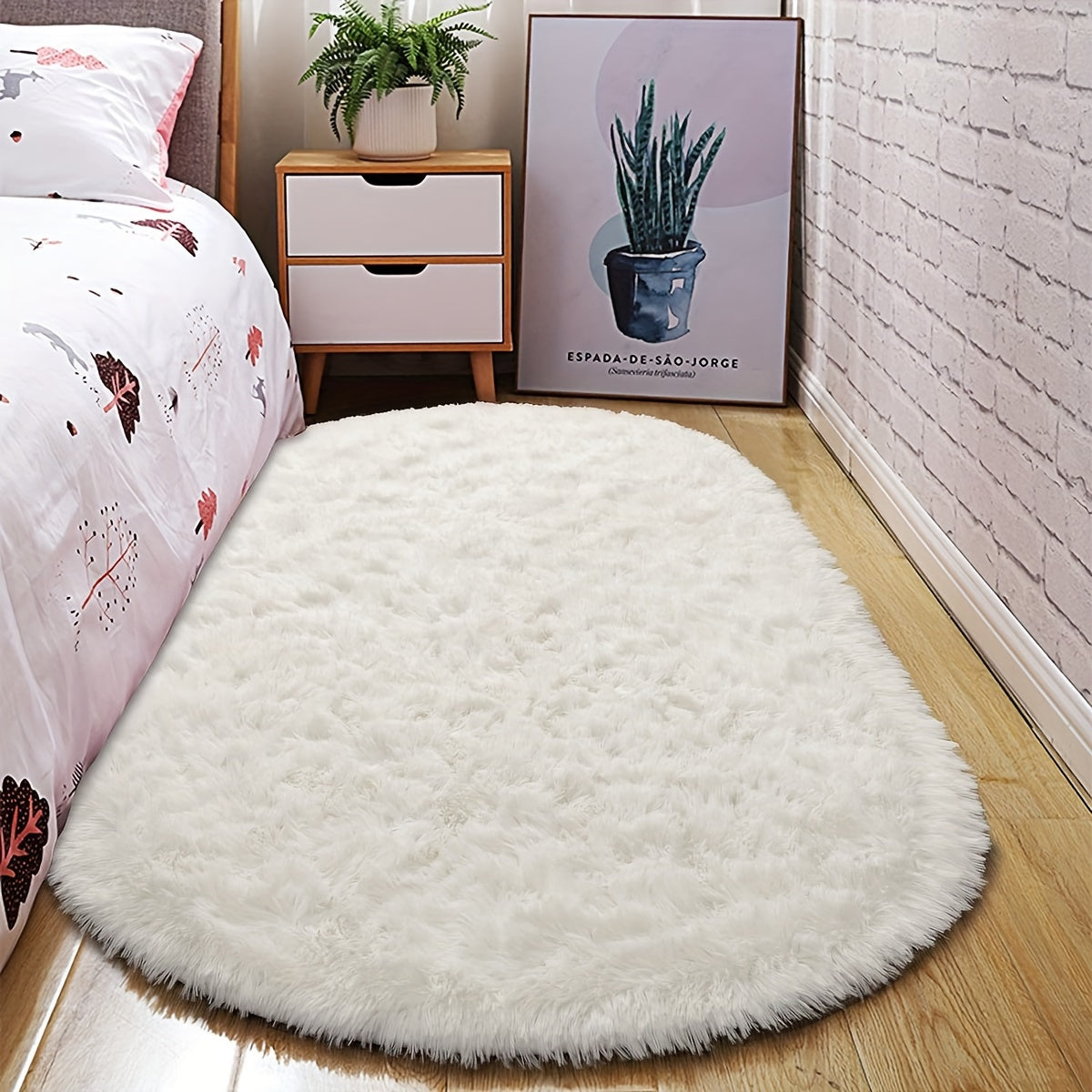 Soft and fluffy oval shaggy area rug, perfect for bedroom or living room. Made with skin-friendly thickened sponge and tufted polyester material. Durable and easy to maintain. Adds decorative touch to indoor spaces such as sofa, bedside, playroom, or