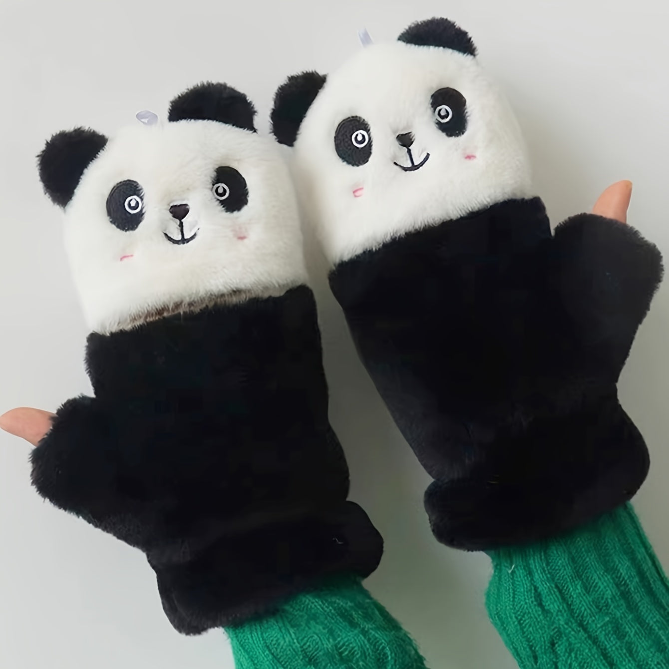 One pair of adorable animal cartoon-themed women's polyester winter mittens with flip tops. These thick, plush fingerless mitts provide warmth and decoration, perfect for casual weekend use. The embroidered design adds a touch of charm to this