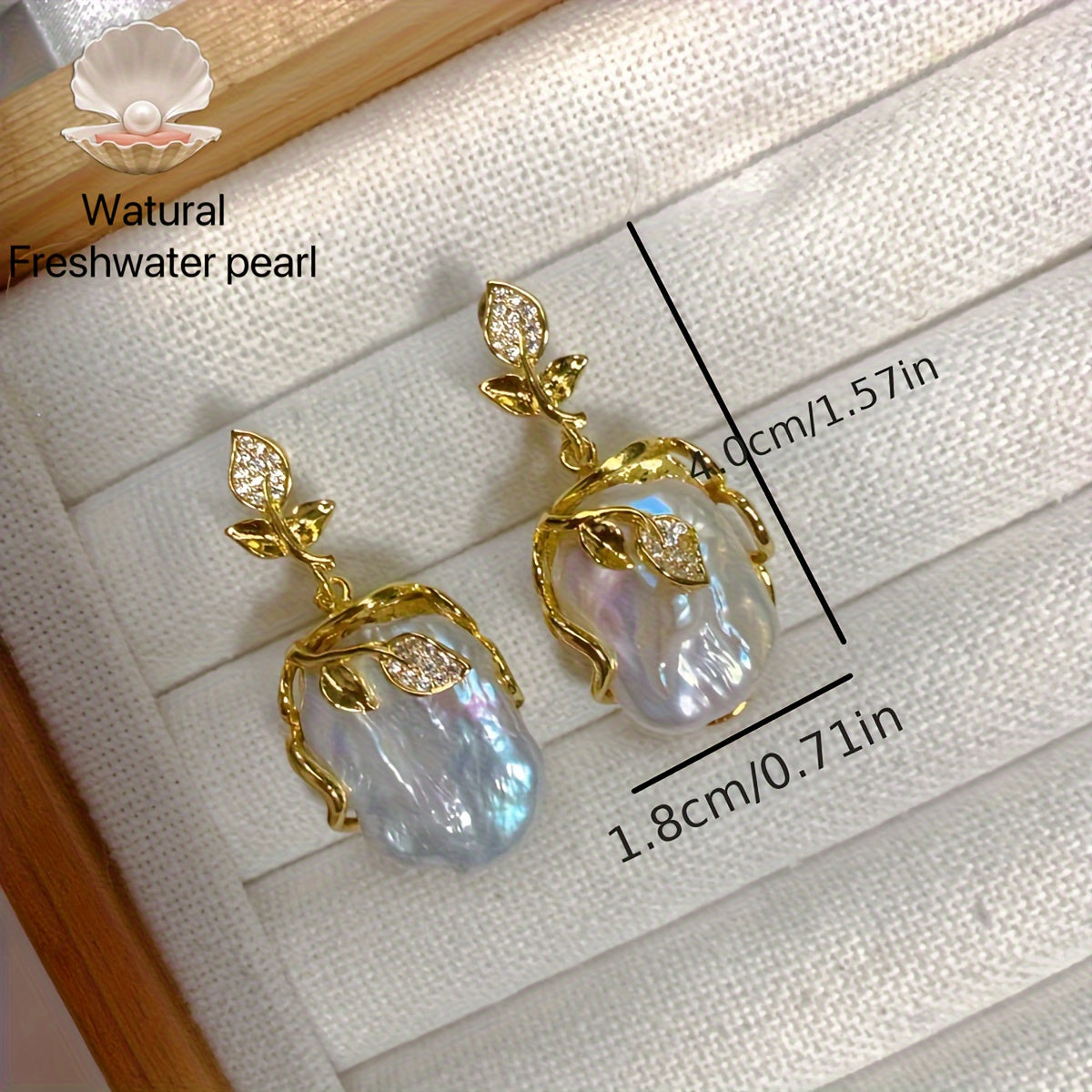 Elegant and luxurious French-inspired freshwater pearl earrings with gold-plated silver leaf accents, perfect for fashion-forward women with a taste for retro style and natural beauty.