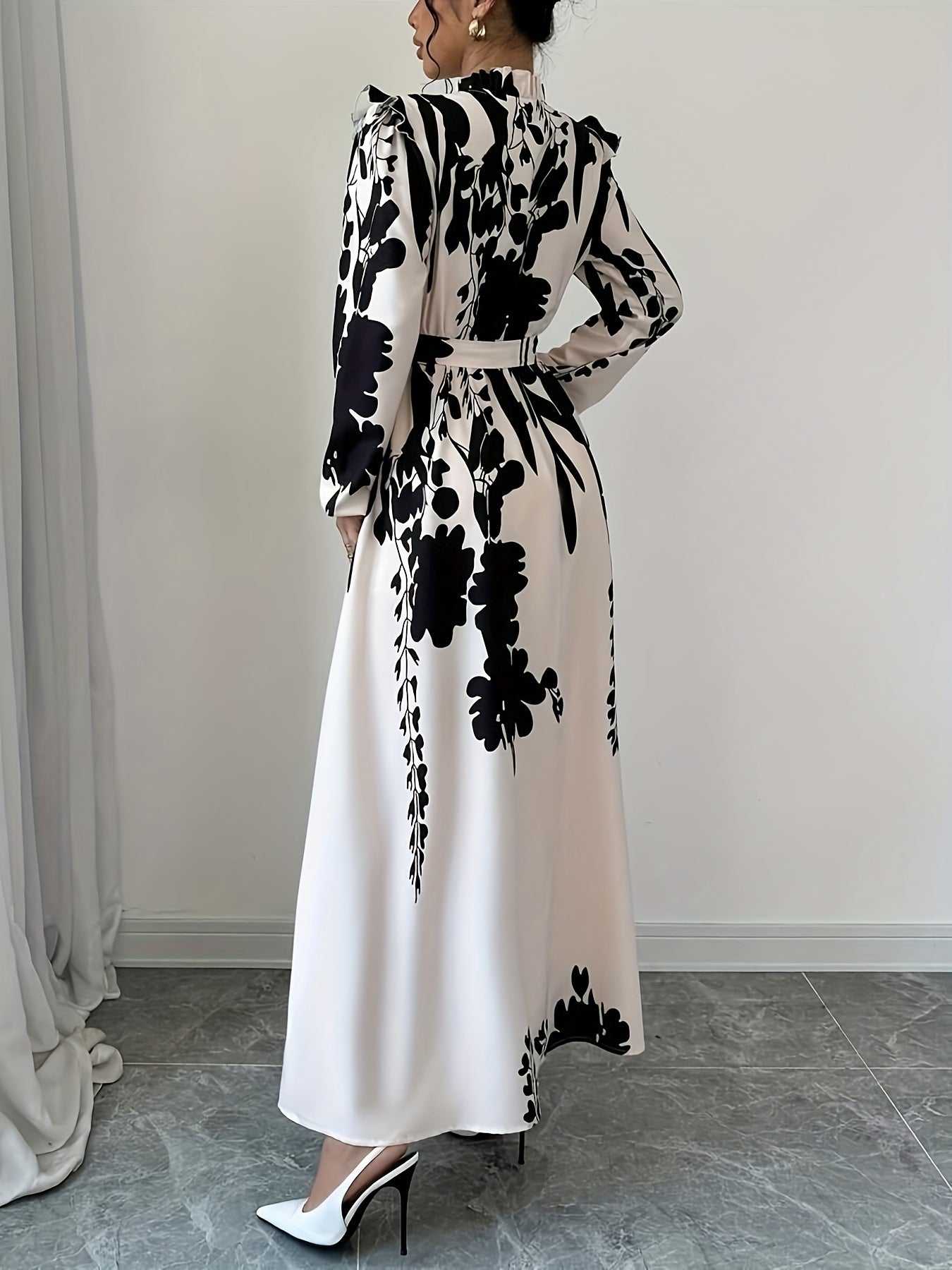 Floral print maxi dress with stand collar, waist detail, lantern sleeves, and ruffle hem, perfect for spring or fall.