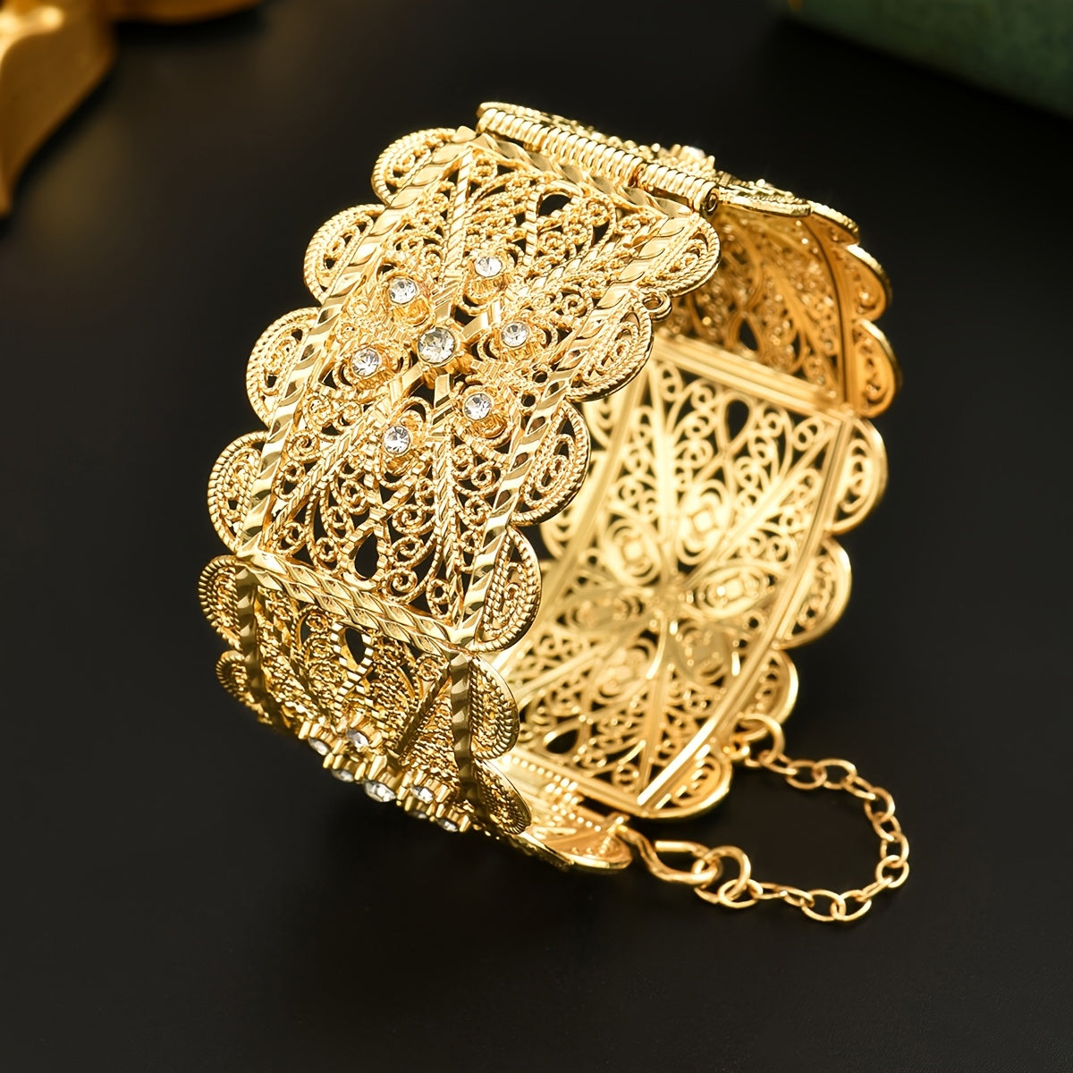 Luxurious 24K Gold Plated Zinc Alloy Bangle featuring Synthetic Stones in an Arabian Style Open Cuff design. This bracelet is adorned with a November birthstone and a beautiful floral theme, making it a perfect accessory for weddings, banquets, and