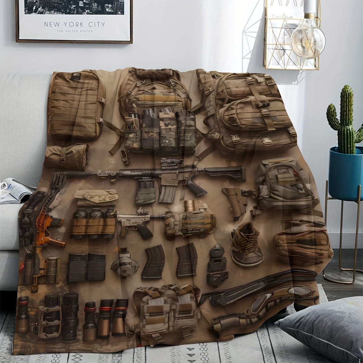 Modern military-inspired flannel throw blanket featuring a hypoallergenic, all-season knit fabric that is lightweight and soft to the touch. Versatile for travel, office use, and home decor, with a digital print tactical equipment design. Perfect for