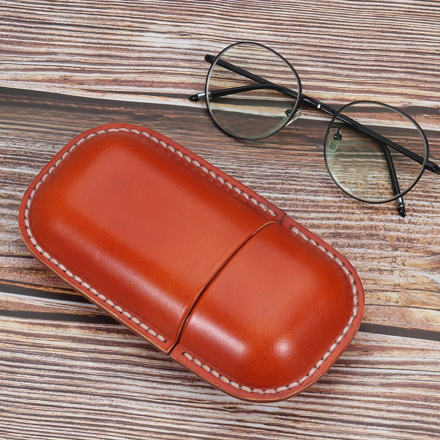 High-quality, stylish faux leather glasses case with retro-inspired design for ultimate protection and storage for your glasses.