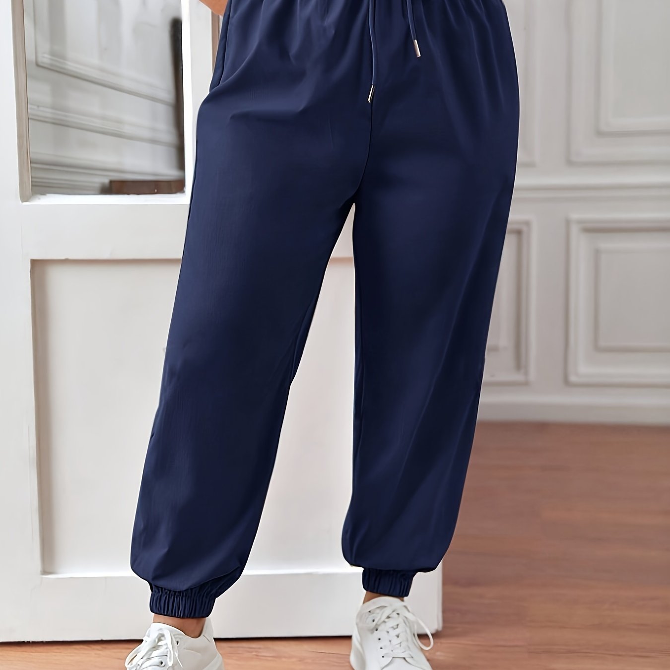 Solid fitted bottom joggers for plus size women, casual drawstring pants for spring and summer.