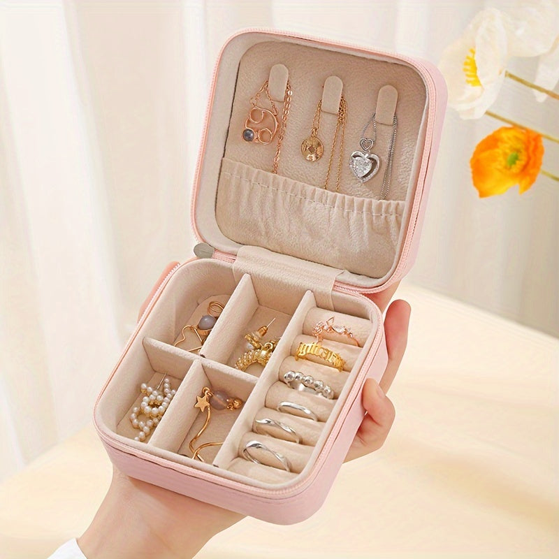 Compact faux leather jewelry organizer box for rings, necklaces, earrings & more. Portable travel case with multi-purpose storage solution. Rectangle shape for organizing.