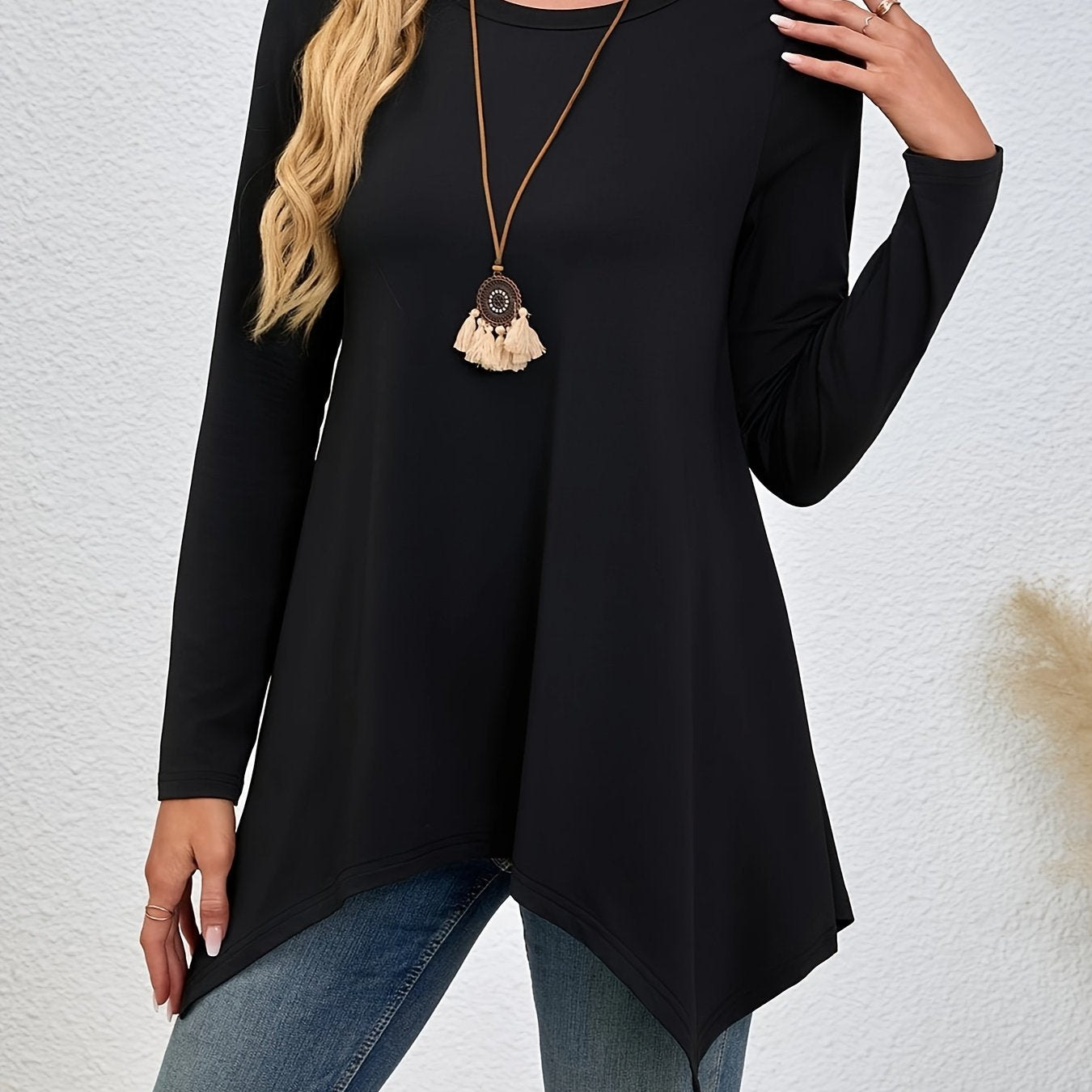 Comfortable lounge tops for women, including round neck long sleeve tunic with asymmetric hem.