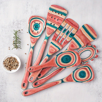 7-piece set of pink wooden kitchen utensils includes non-stick, heat-resistant cooking tools such as a spatula, rice and pasta servers, salad mixer, and pizza shovel. Ideal for Halloween, Christmas, and Thanksgiving festivities.