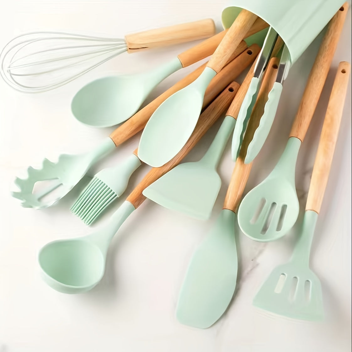 Set of 12 silicone utensils with khaki color and wooden handles, ensuring safety while cooking. These non-stick kitchen tools are washable and modern, providing a range of cookware and gadgets for your kitchen.