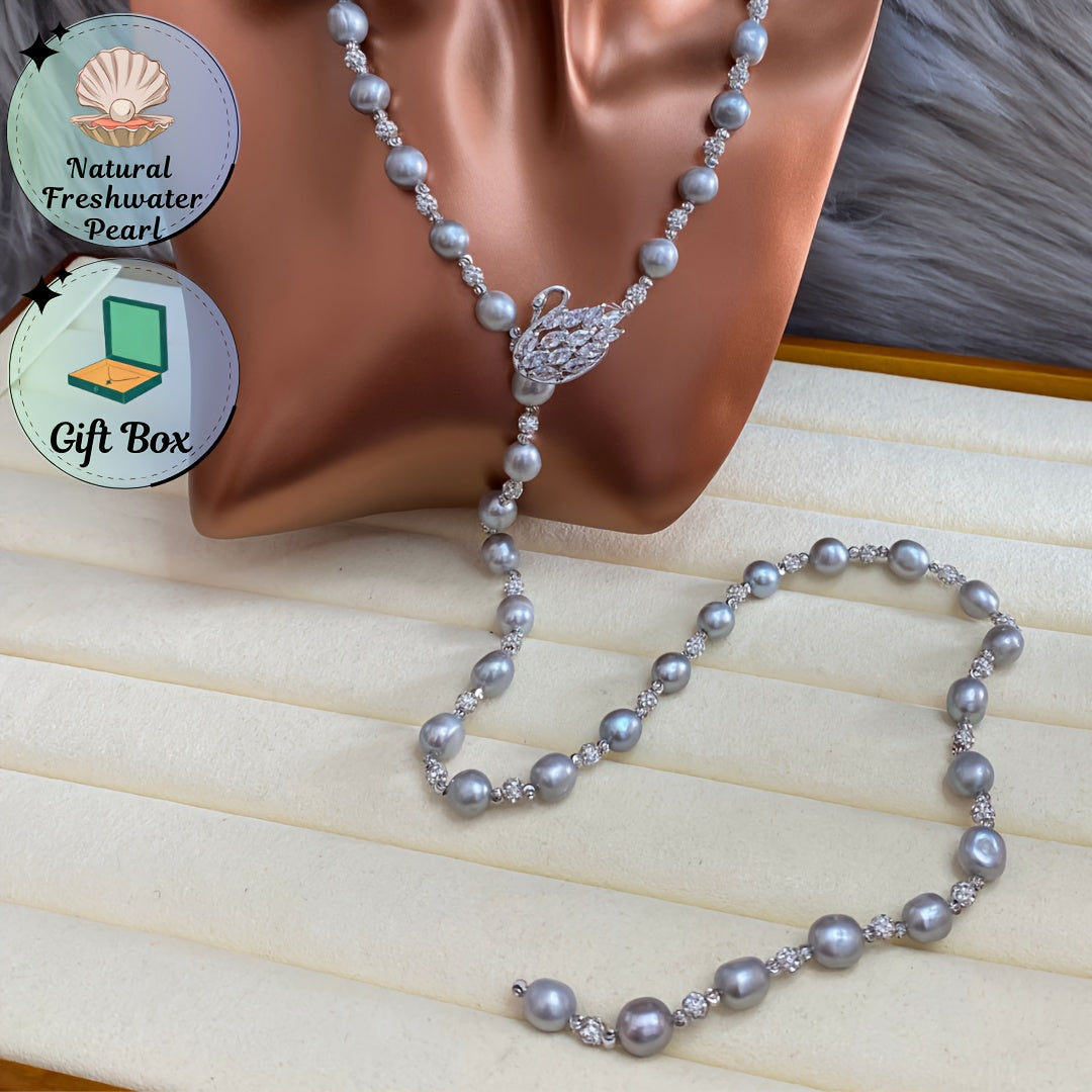 This sophisticated Baroque freshwater pearl Y-necklace features a swan clasp in a silvery gray hue, making it the ideal accessory for fall and winter fashion. It also makes for a perfect Thanksgiving gift.