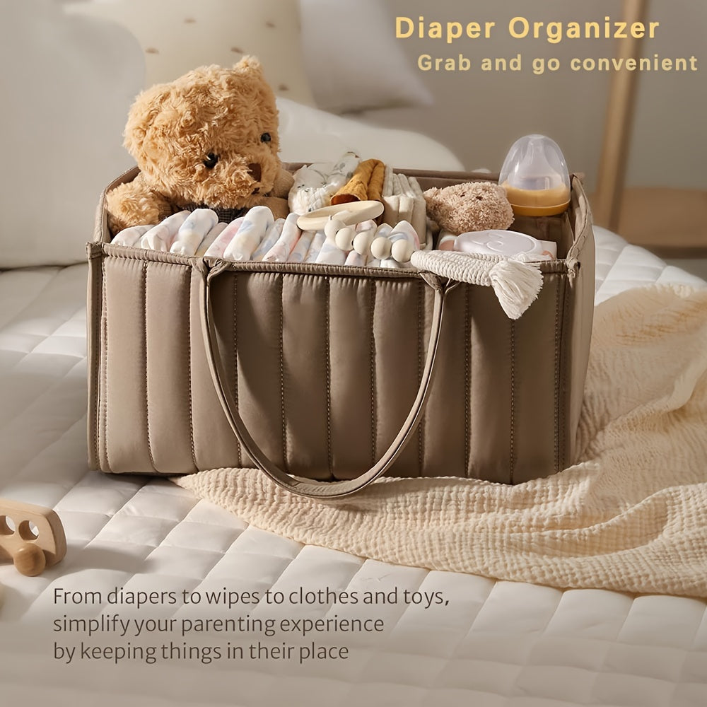 Portable nursery storage basket with handle made of polyamide, designed to organize diapers conveniently. This caddy is essential for keeping diapers, clothes, and toys in order. Perfect as a shower gift or registry item for new parents.