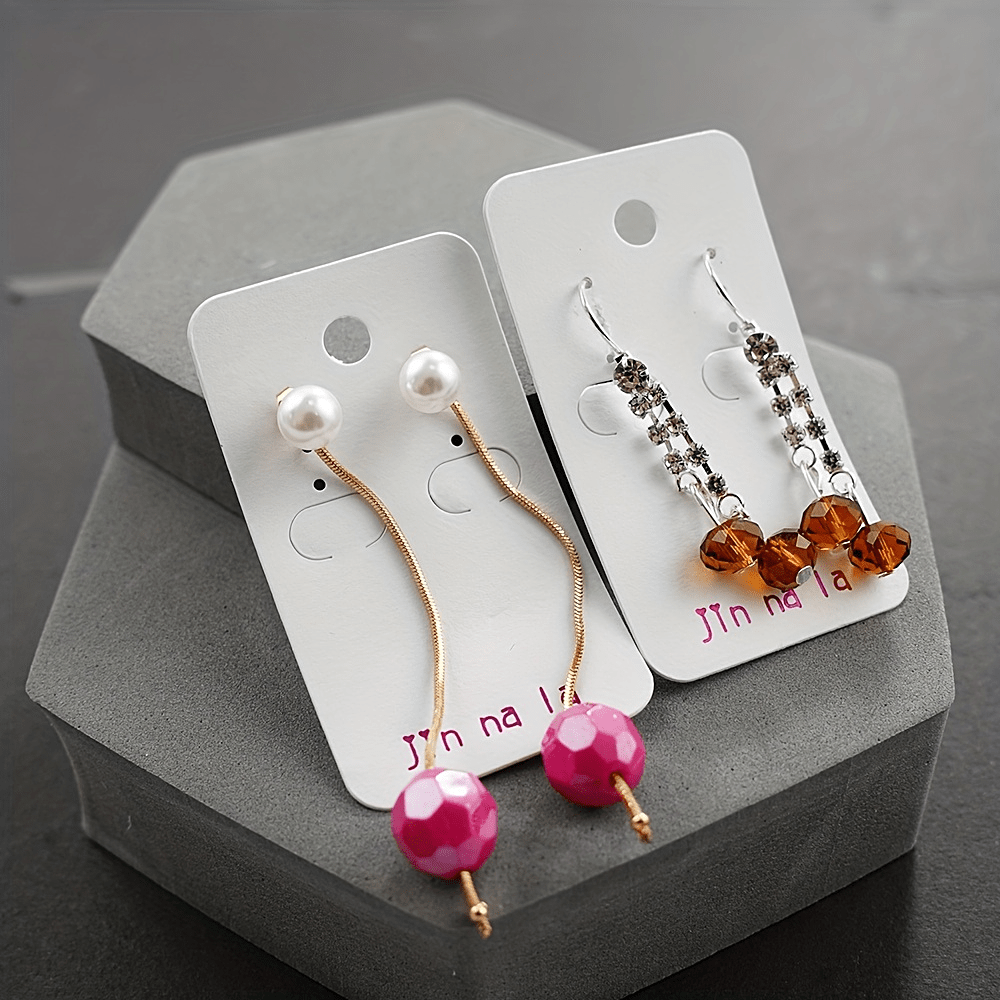 Set of 20 pairs of dangle earrings adorned with dazzling rhinestones, featuring an elegant and classic style. Crafted from zinc alloy, these trendy accessories are perfect for adding a touch of sophistication to any outfit. Ideal for fashionable women