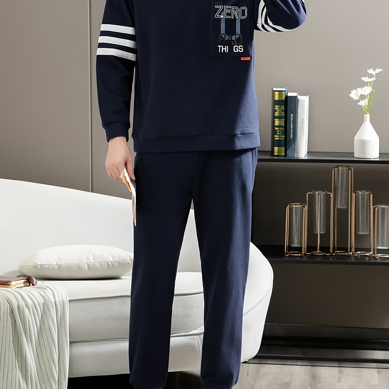 Casual cotton pajamas set for men with letter graphic print, long sleeve crew neck top with chest pocket and loose pants. Suitable for spring and autumn.